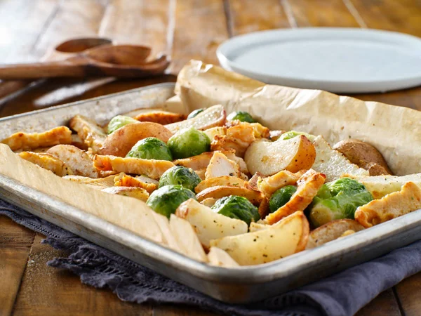 homemade one pan meal with baked chicken, brussel sprouts and potatoes