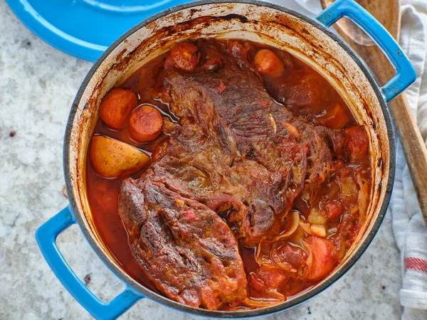 beef roast baked in dutch oven with rosemary