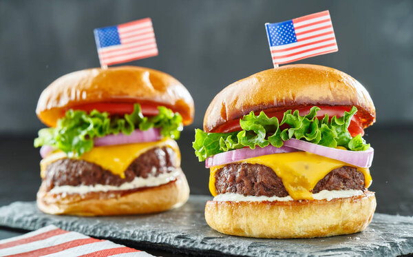 4th of july themed cheeseburgers with mini flags