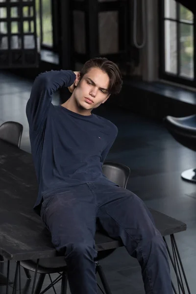 Dreamy Handsome Slim Young Guy Sitting Table Hand His Hair — Stock Photo, Image