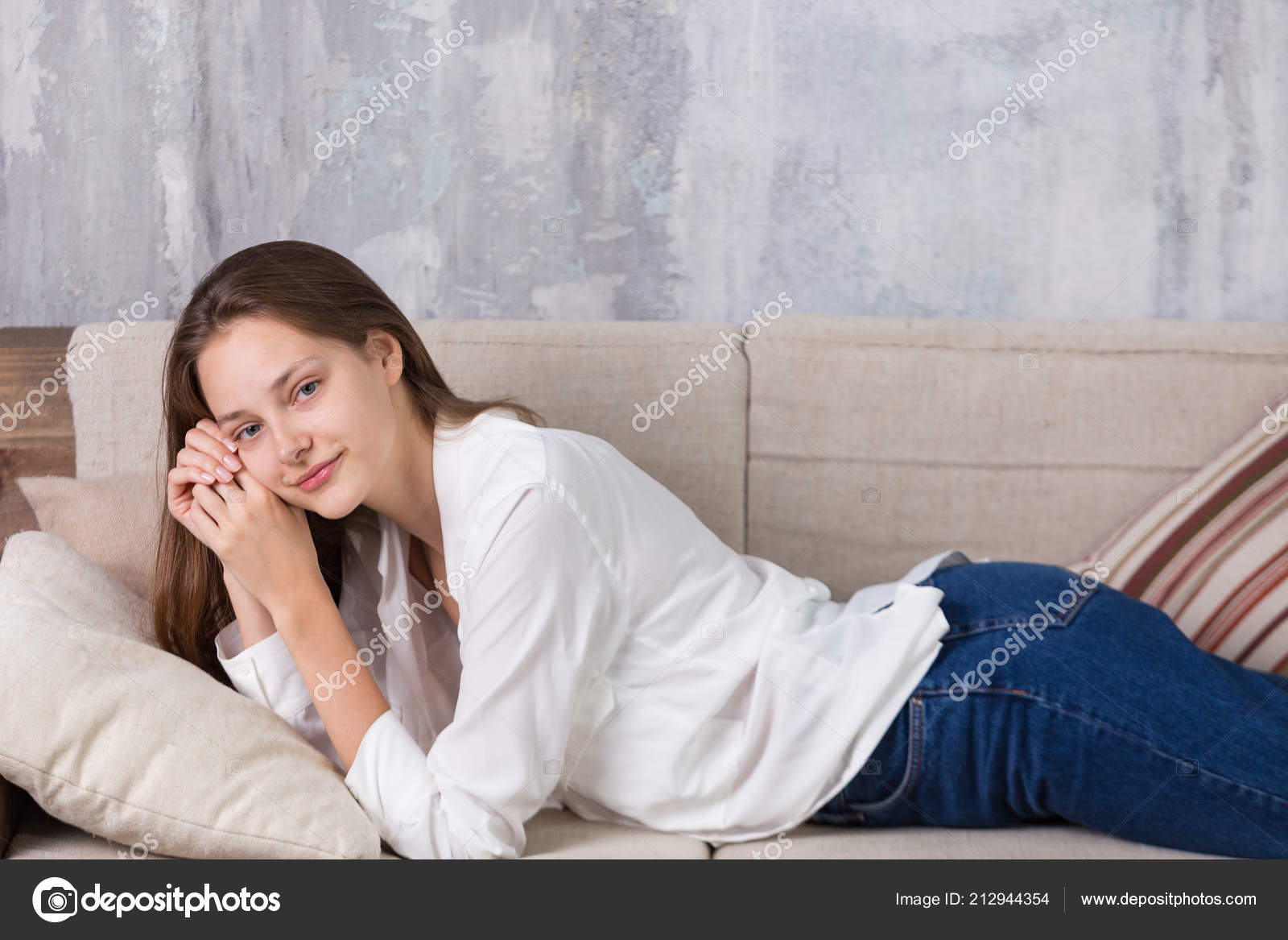 Beautiful Girl Brown Hair Blue Eyes Laying Sofa White Shirt