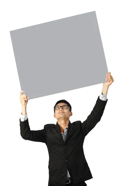 Portrait of  young businessman showing blank signboard clipping — Stock Photo, Image