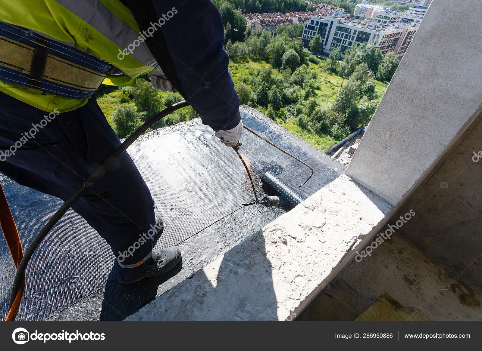 Laying Waterproofing On The Floor Of The Balcony During The Con