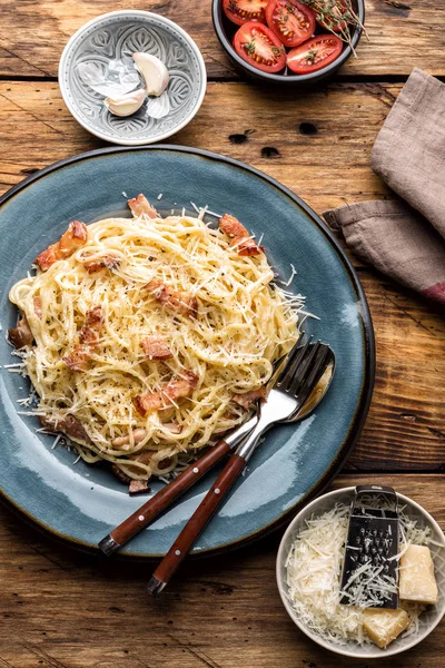 pasta carbonara, spaghetti, cooked according to the traditional Italian recipe pasta alla carbonara with egg sauce and fried pancetta