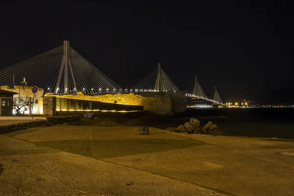 View of Rio-Antirio bridge at night, Greece. The Rio Antirrio Bridge is one of the world\'s longest multi-span cable-stayed bridges.