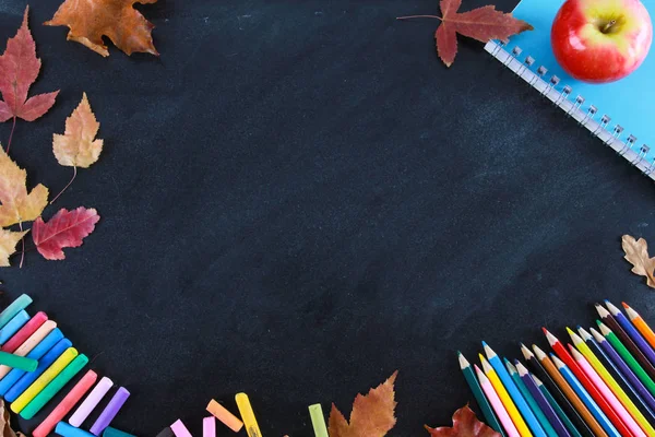 Colored Pencils Notebook Crayons Red Apple Fall Leaves Blackboard Top — Stock Photo, Image