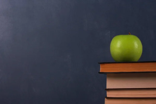 Green Apple Stack Books Dark Blue Wall Background Side View Stock Picture