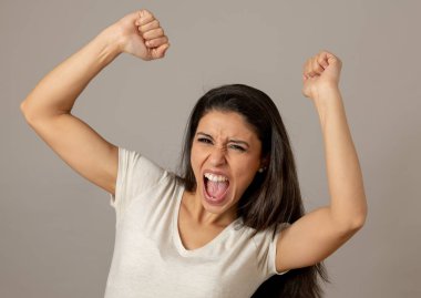 Young beautiful latin happy euphoric and excited woman celebrating winning the lottery. Positive human facial expressions and emotions. People success, life perception, achievement clipart