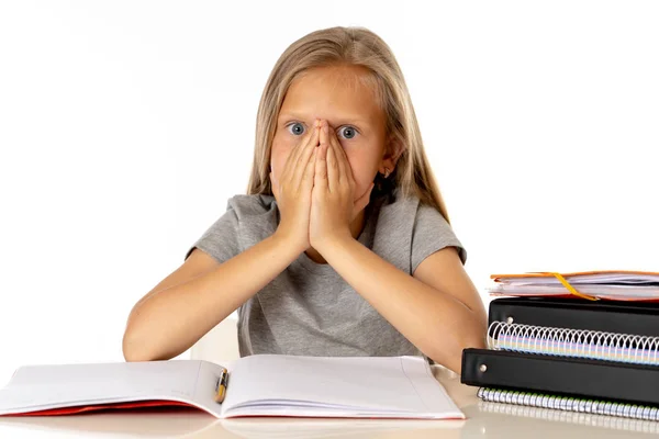 Sweet Young Little Schoolgirl Stress While Sitting School Desk Doing Stock Photo