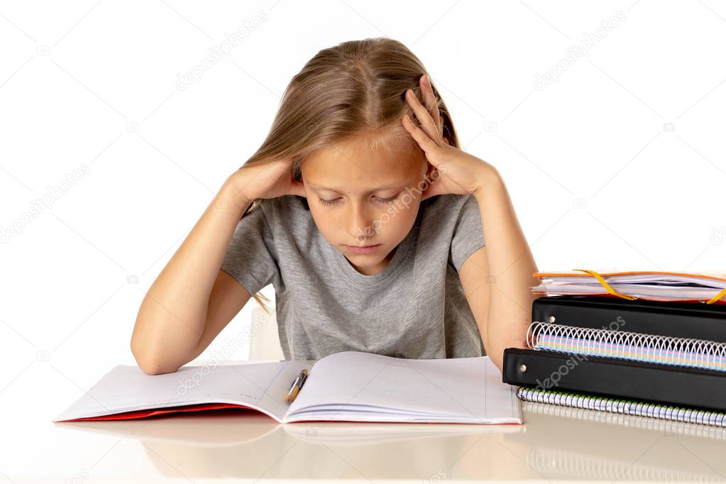 Tired young cute blonde schoolgirl with learning difficulties thinking about studying. education problems concept  on Isolated on white background