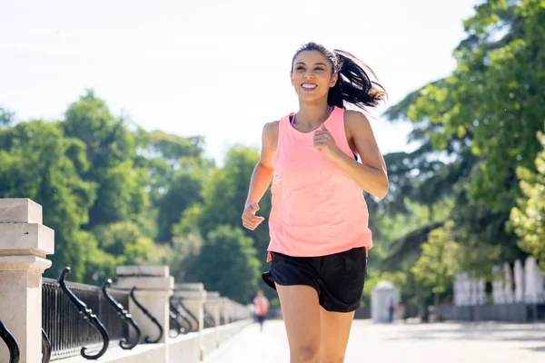 Stylish fit woman in sport outfit walking on sport square. Attractive  sportswoman, enjoying summer, training, outwork, happiness Stock Photo