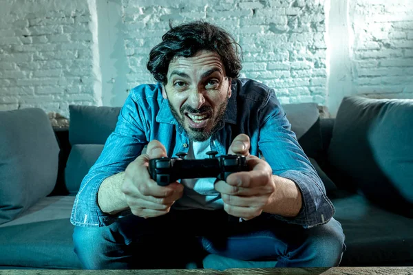 Young Excited Latin Man Home Sitting Living Room Sofa Playing — Stock Photo, Image