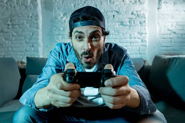 Young Excited Latin Man Home Sitting Living Room Sofa Playing — Stock Photo, Image