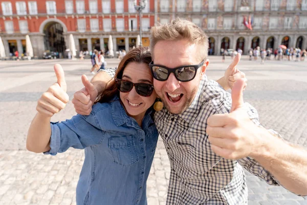 Happy Couple Hugging Showing Thumbs Plaza Major Old Town Madrid — Stock Photo, Image