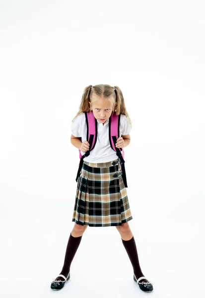 学校制服気持ち怒っているとカメラを見てはイライラの小さな女の子は 白い背景の上分離 教育の概念に戻って宿題学習困難 — ストック写真
