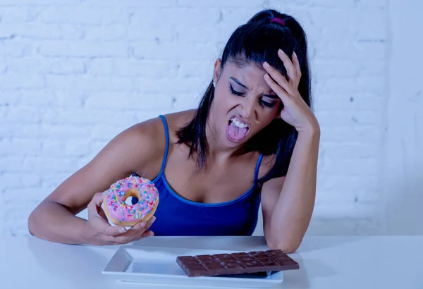 Attractive healthy fit woman rejecting donuts and chocolate in no more junk unhealthy food, Diet, Healthy eating Habits