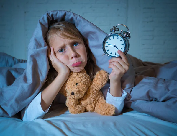 Cute Sleepless Little Girl Lying Bed Showing Alarm Clock Looking — Stock Photo, Image