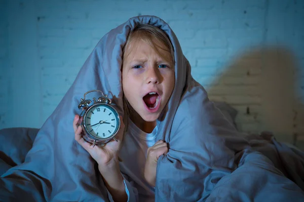 Cute Sleepless Little Girl Lying Bed Showing Alarm Clock Looking — Stock Photo, Image