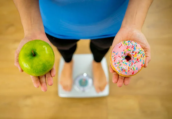 Close Woman Scale Holding Hands Apple Doughnut Making Choice Healthy — Stock Photo, Image
