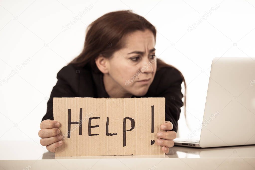 Young attractive depressed latin businesswoman holding help sign message exhausted under pressure and stress isolated on white in Unemployment Gender discrimination Depression and overwork concept.