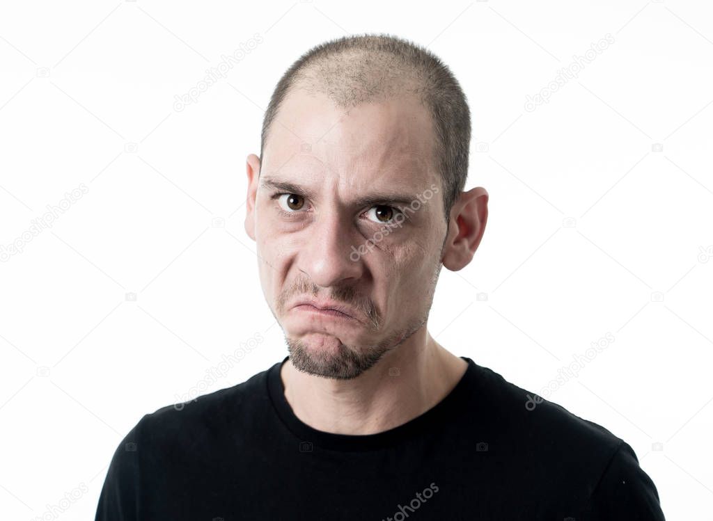 Portrait of angry and upset young man looking furious, aggressive and crazy in People and human emotions, facial expressions and abuse, violence and bullying concept. Isolated on white background.