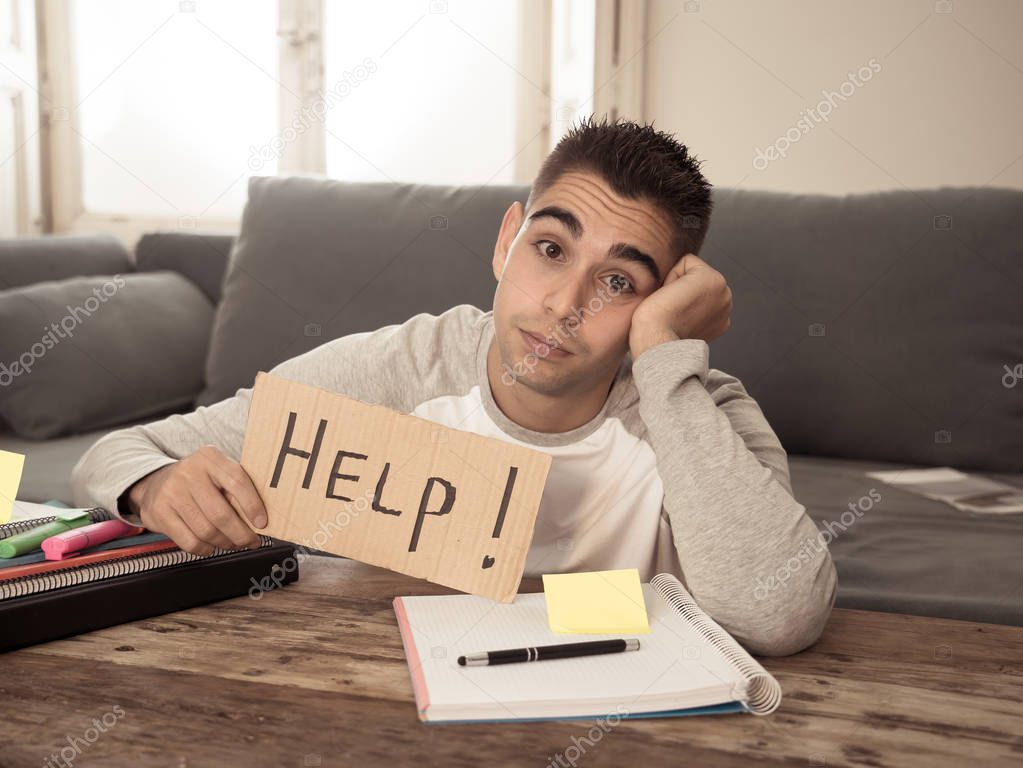 Young tired and stressed student working on his homework, masters feeling desperate and frustrated asking for help. In over Education, learning difficulties, finals exams and emotional stress concept.