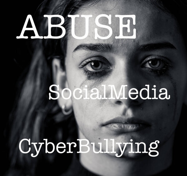 Dramatic closeup portrait of upset desperate girl bullied online suffering harassment crying and feeling intimidated. Child victim of cyberbullying,stalker, social media and dangers of the Internet.