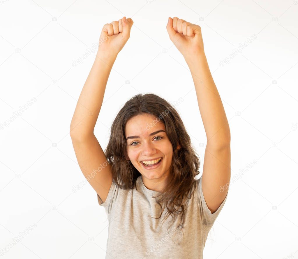 Portrait of beautiful shocked girl celebrating victory, having great success with surprised and happy Face and gestures. In Facial Expression, Human Emotions and happiness concept. Isolated on white.