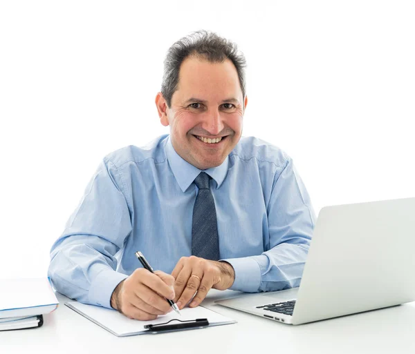 Attractive happy mature caucasian businessman working on laptop computer feeling successful at work Royalty Free Stock Images