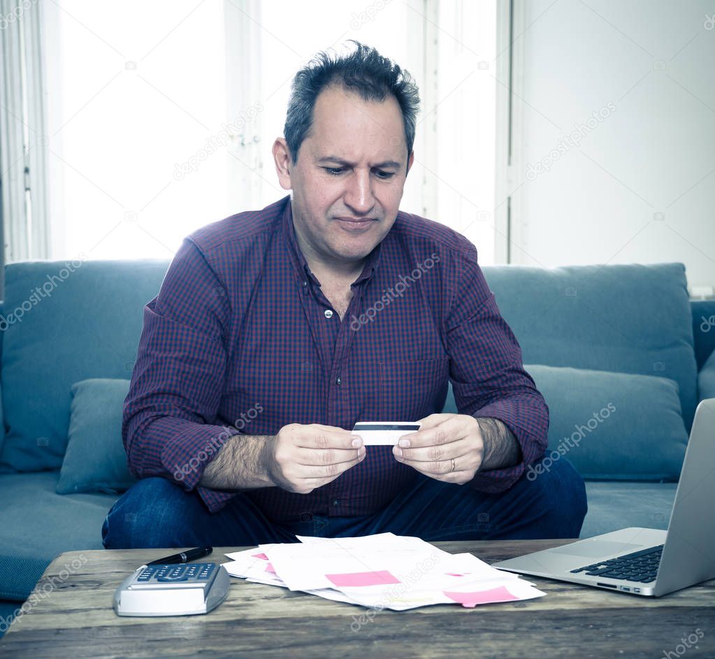 Upset mature man stressed about credit card debts and payments not happy accounting finances