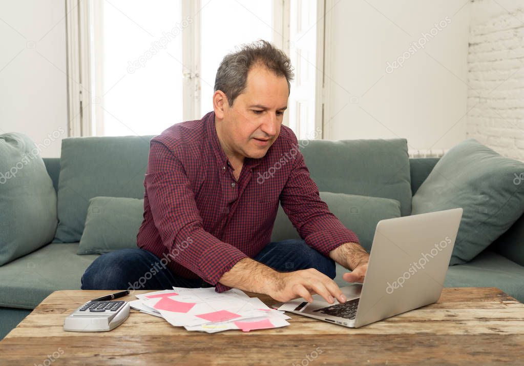 Upset middle aged man stressed about credit card debts and payments not happy accounting finances