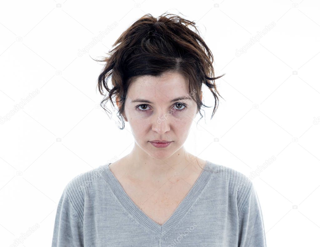 Close up of young attractive caucasian woman with an angry face. Looking mad and crazy shouting and making furious gestures. Isolated on neutral background. Facial expressions and emotions.