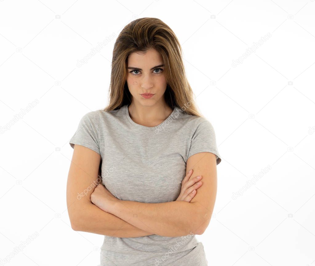 Annoyed irritated young woman with an angry face looking furious, mad and feeling frustrated with someone. Close up studio shot Isolated on white background. People, Facial expressions and emotions.