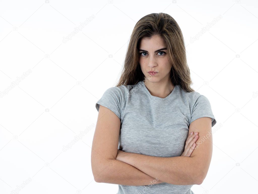 Annoyed irritated young woman with an angry face looking furious, mad and feeling frustrated with someone. Close up studio shot Isolated on white background. People, Facial expressions and emotions.