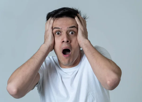 Portrait Of Young Man In Shock With Scared Face Paralysed With