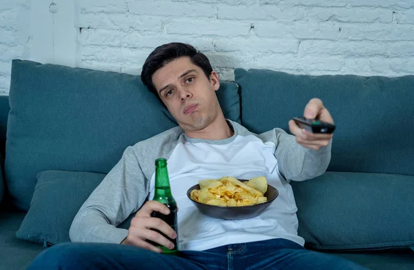 Lifestyle Portrait Young Bored Man Couch Remote Control Zapping Movie — Stock Photo, Image