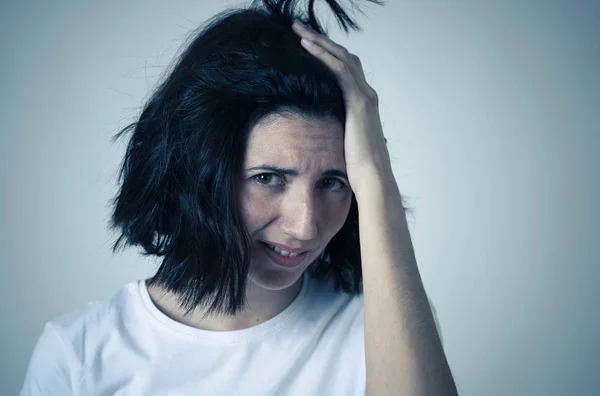 Portrait of sad and hopeless woman. Isolated in white background. Human expressions and emotions — Stock Photo, Image