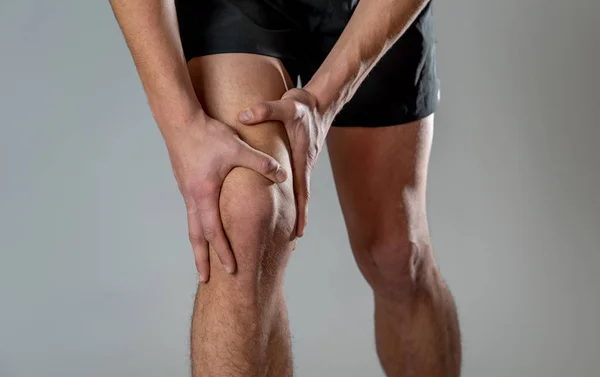 Young Fit Man Holding Knee Hands Pain Suffering Muscle Injury — Stock Photo, Image