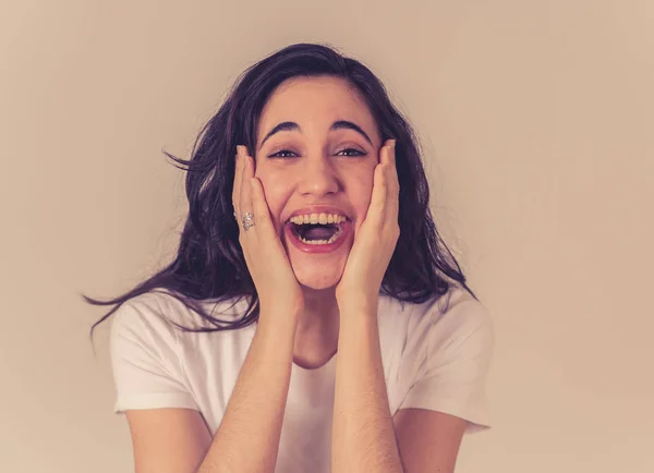 Excited latin teenager girl surprised and shocked feeling amazed by Unbelievable sales, Great news or Success. Woman screaming with overjoy, Euphoric winner. People expressions and positive emotions.