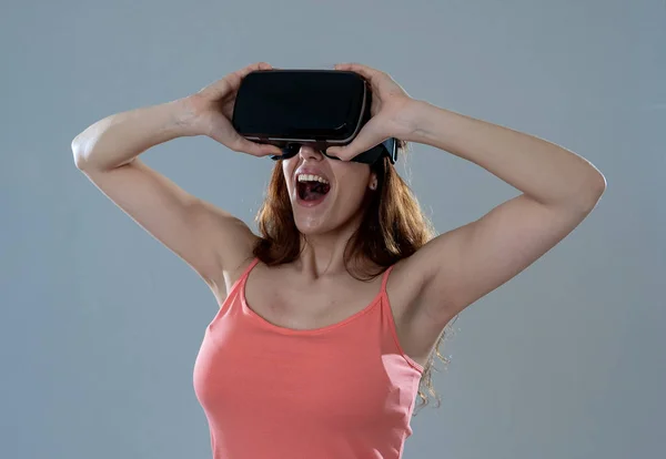 Amazed woman getting experience using VR headset glasses, feeling excited about simulation, exploring virtual reality making gestures interacting with new virtual world. In new technology concept.