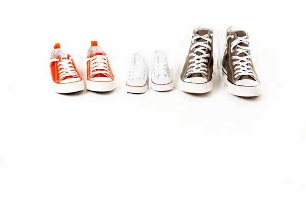 Konceptuell Bild Joggingskor Sneakers Far Mor Och Son Dotter Isolerad — Stockfoto