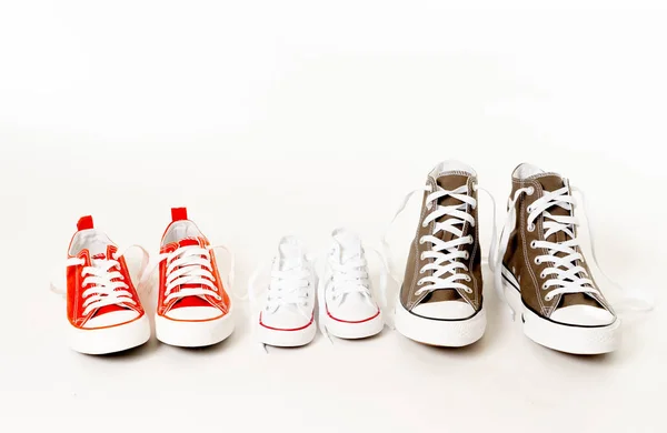 Conceptual Image Gumshoes Sneakers Father Mother Son Daughter Isolated White — Stock Photo, Image