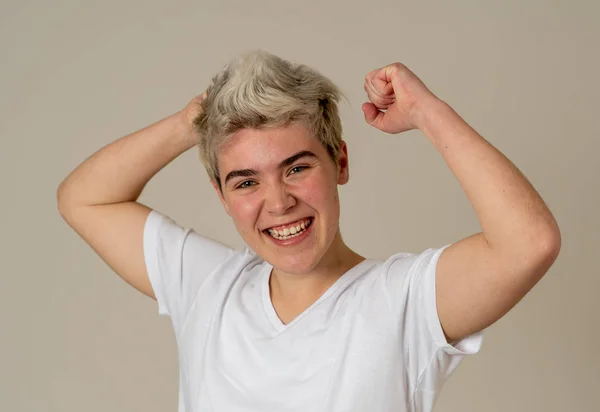 Portrait of young happy and excited transgender teen happy and excited winning, celebrating goal or having great success with proud face. In People Diversity and positive Human Emotions.