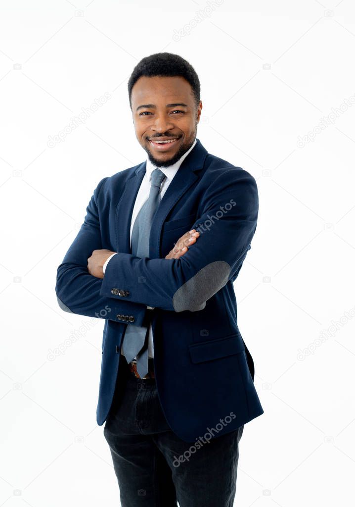 Half-length portrait of confident handsome african american businessman in fashion modern formal wear suit standing and looking happy. Isolated on white background. Concept of leadership and success.