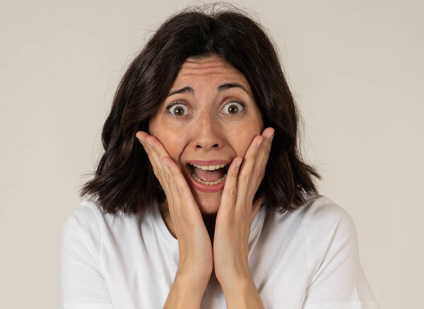 Close up of young woman with frightened eyes, shocked making fear, anxiety gestures. Looking terrified and desperate. People and Human expressions and emotions concept. Isolated on neutral background.