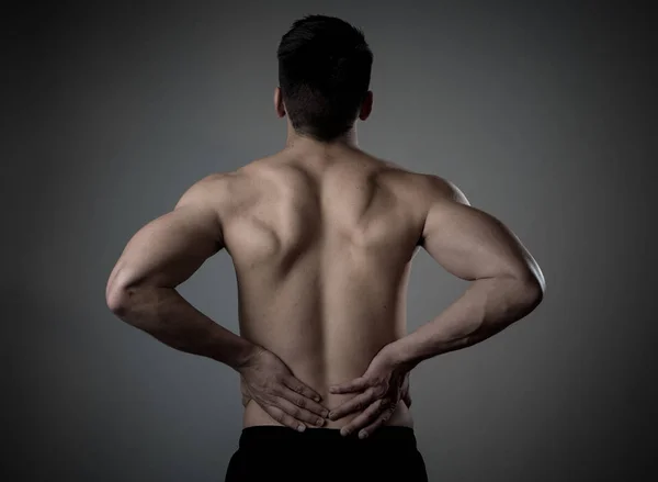 Joven Hombre Fitness Muscular Tocando Agarrando Espalda Baja Sufriendo Fuerte —  Fotos de Stock