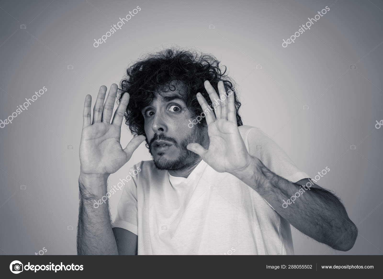 Portrait Of Young Man In Shock With A Scared Face Expression