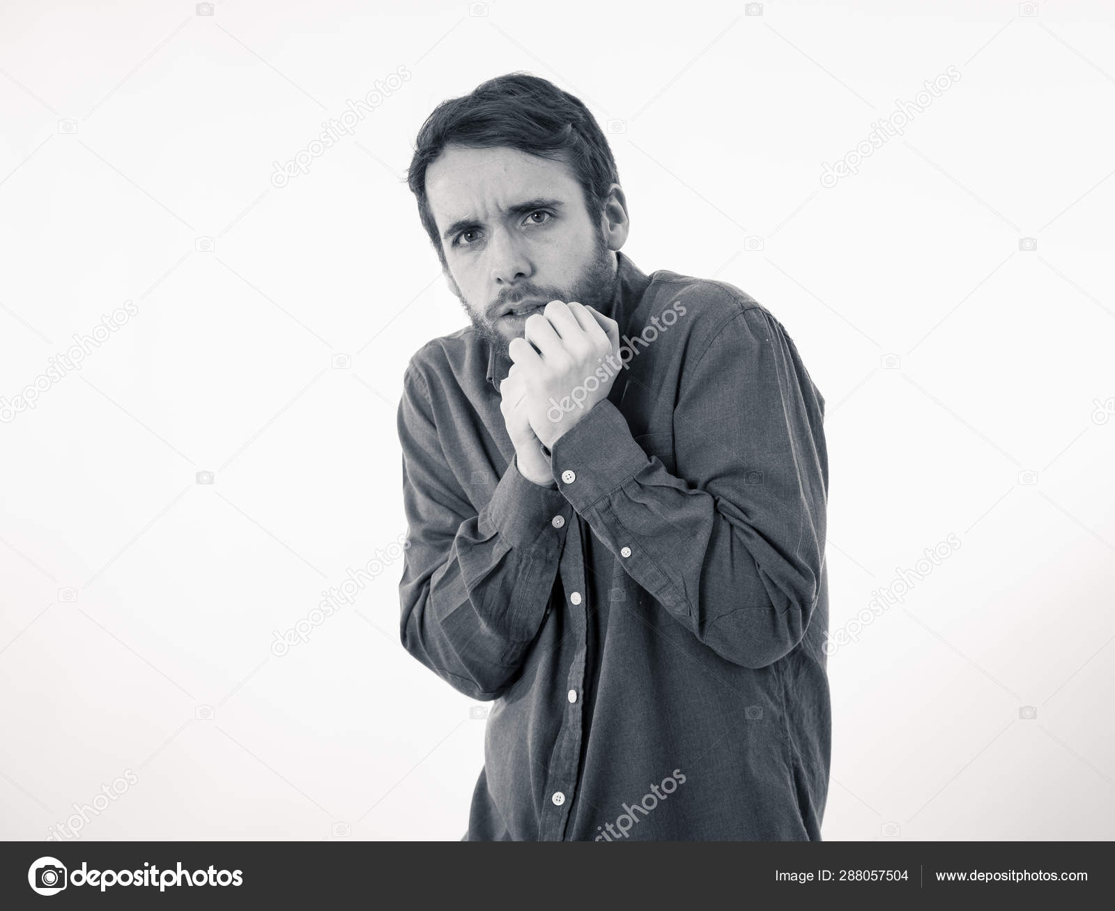 Portrait Of Young Man In Shock With A Scared Face Expression