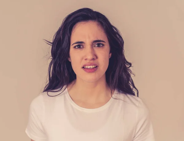 Stock image Close up of young attractive frustrated latin woman in stress with furious face. Looking mad and disappointed making angry gestures. In neutral background. In human facial expressions and emotions.