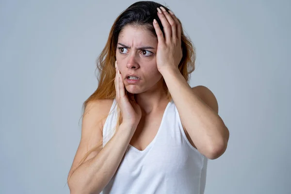 Young woman feeling scared and shocked making fear, anxiety gestures. Looking terrified and desperate. People and Human emotions and Violence and aggression social issues concept.